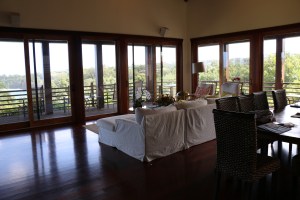 The living room, with surrounding picture windows.