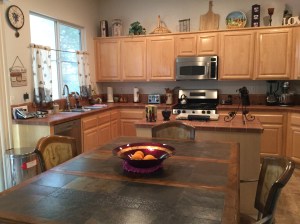 The sink and left corner of the kitchen.