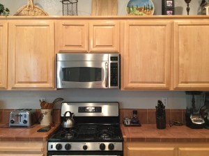 Cabinets over the microwave and range.