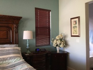 Master Bedroom after painting - the wall beside the bed is a darker teal and the rest of the walls a very light teal.