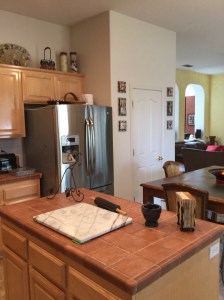 The pantry, next to the refrigerator.