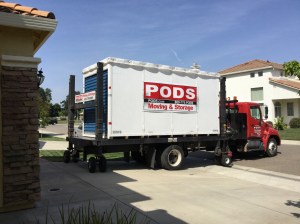 Driver backing the POD into the driveway.