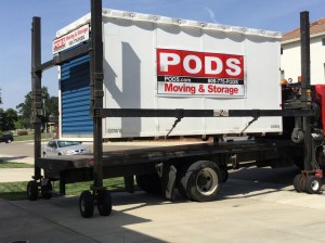 The POD is lifted of the flatbed of the truck.