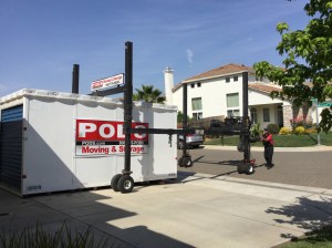 The lift is moved back onto the flatbed using a hand-operated steering mechanism.