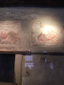 Paintings on the walls of the brothel are graphic sex scenes.
