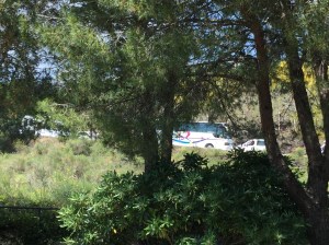 We can see the vehicles up the hill stacking up as the reach the corner where our bus broke down.